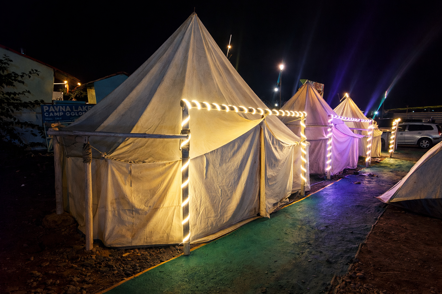 Tents glowing under starry skies